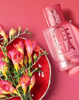 Solinotes Paris Freesia Eau de Parfum - Beauty shot, product displayed next to flowers