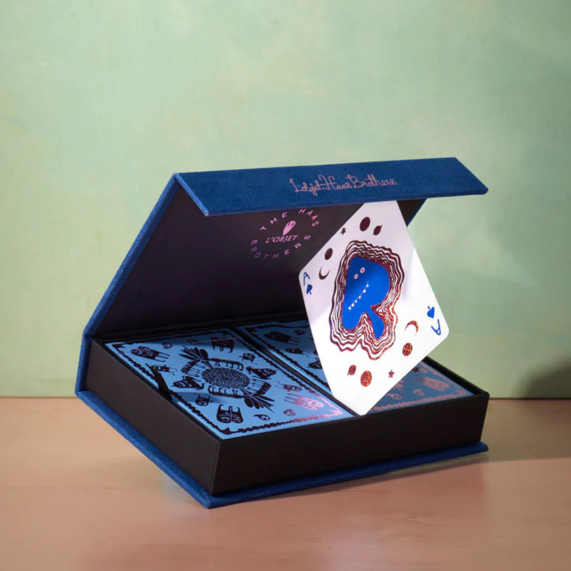 L&#39;Objet Haas Playing Cards - Blue - Product shown propped open with playing card