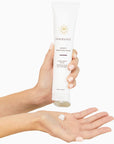 Innersense Organic Beauty Serenity Smoothing Cream - Model shown dispensing product into hand