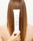 Innersense Organic Beauty Serenity Smoothing Cream - Product shown in front of models hair