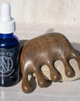 Neil Naturopathic Scalp Massager - Product shown next to Elixir Oil