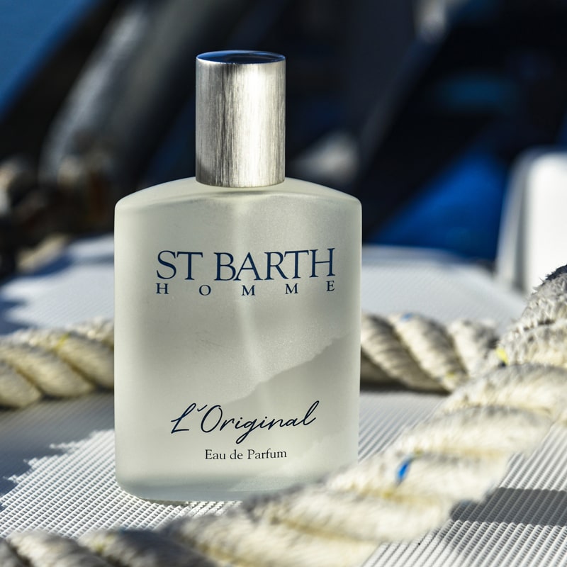 St. Barth Homme L&#39;Original Eau de Parfum in a lifestyle photo with a ship&#39;s rope