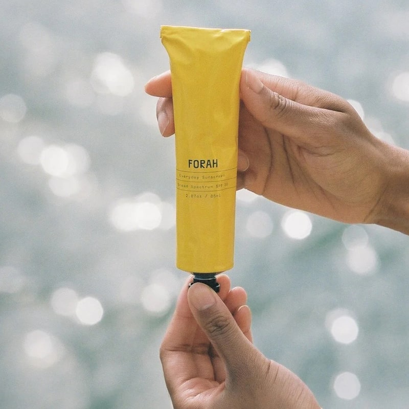 FORAH Everyday Mineral Sunscreen SPF 30 - Product shown in models hand