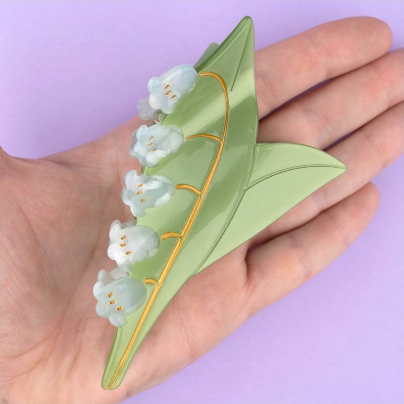 Coucou Suzette Lily of the Valley Hair Claw - Product shown in models hand