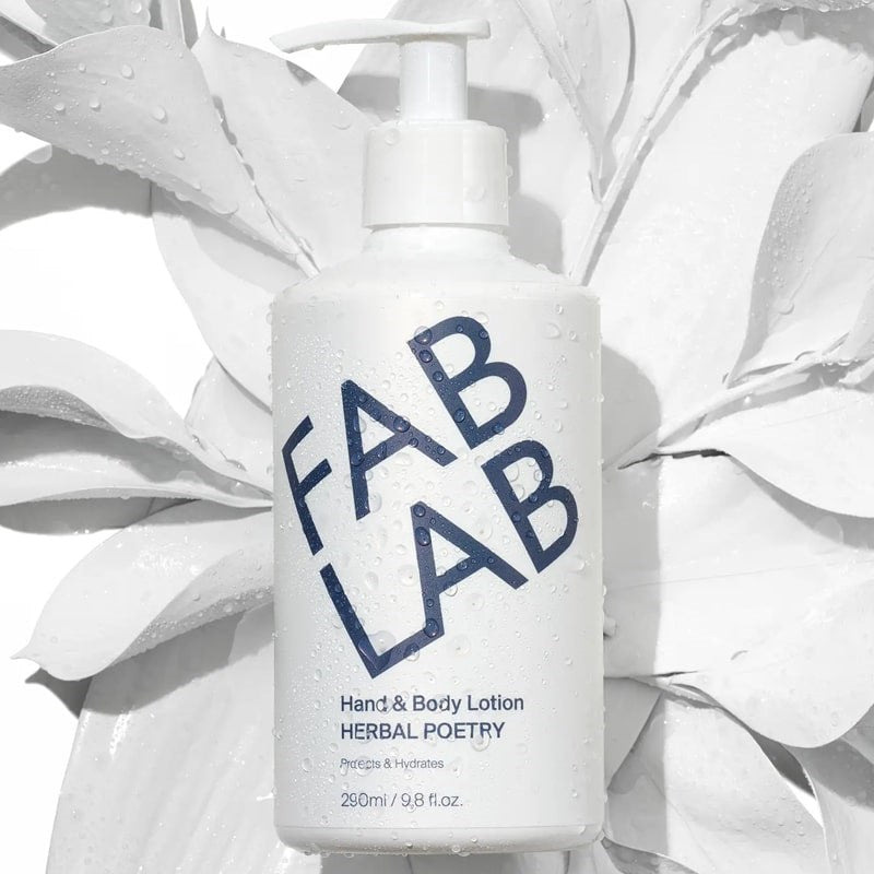FABLAB Skincare Hand &amp; Body Lotion - Herbal Poetry - Product shown on top of plant