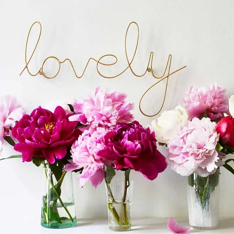 Bombay Duck Lovely Wire Word – Gold - Product displayed on wall