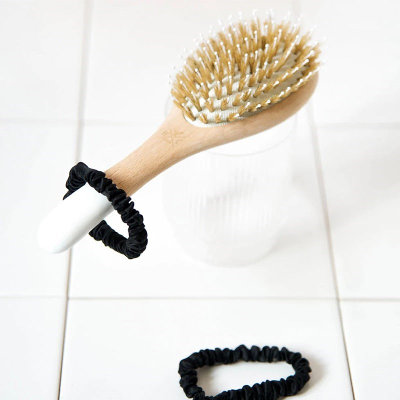Bachca Paris Black Silk Scrunchies - scrunchies on tile flow with hairbrush