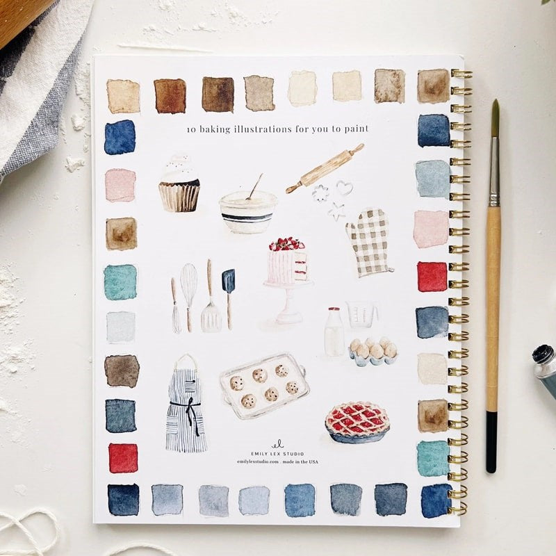 Emily Lex Studio Baking Watercolor Workbook - Product shown next to paint brush