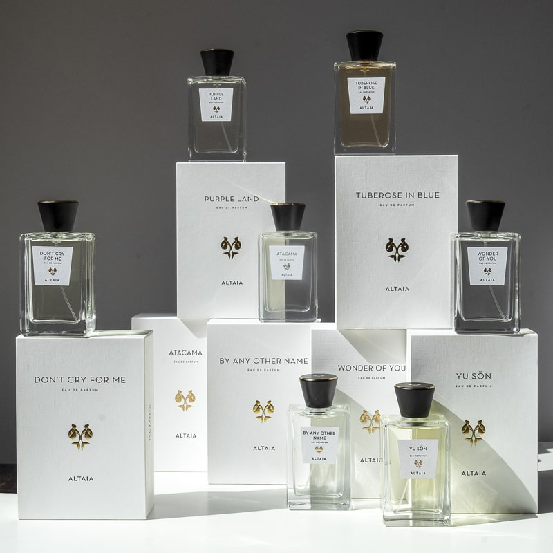 Up Close & Personal with ALTAIA Parfum showing perfume bottles and boxes stacked