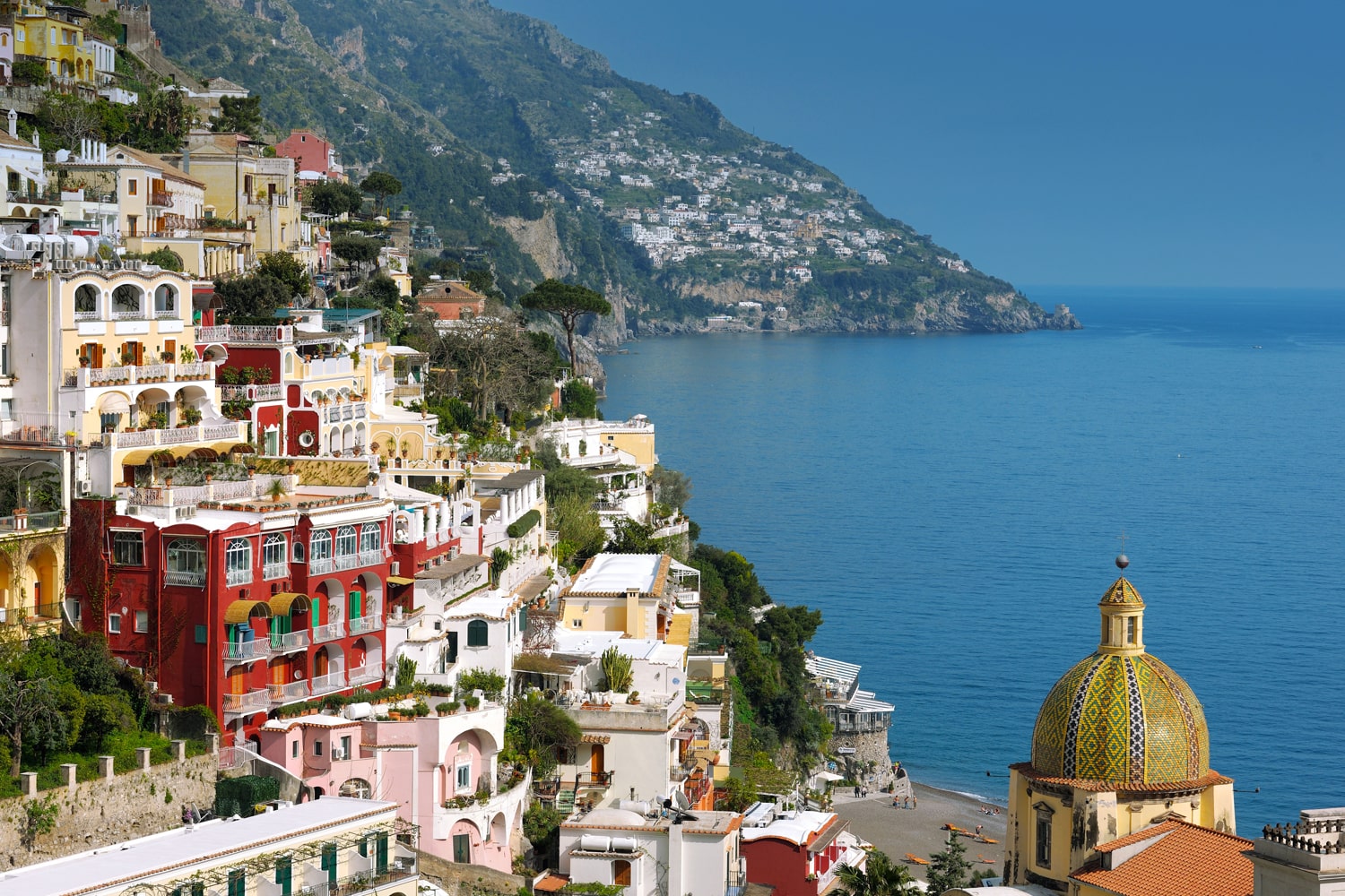 Positano hillside showing Hotel Le Sirenuse, with ocean in the background