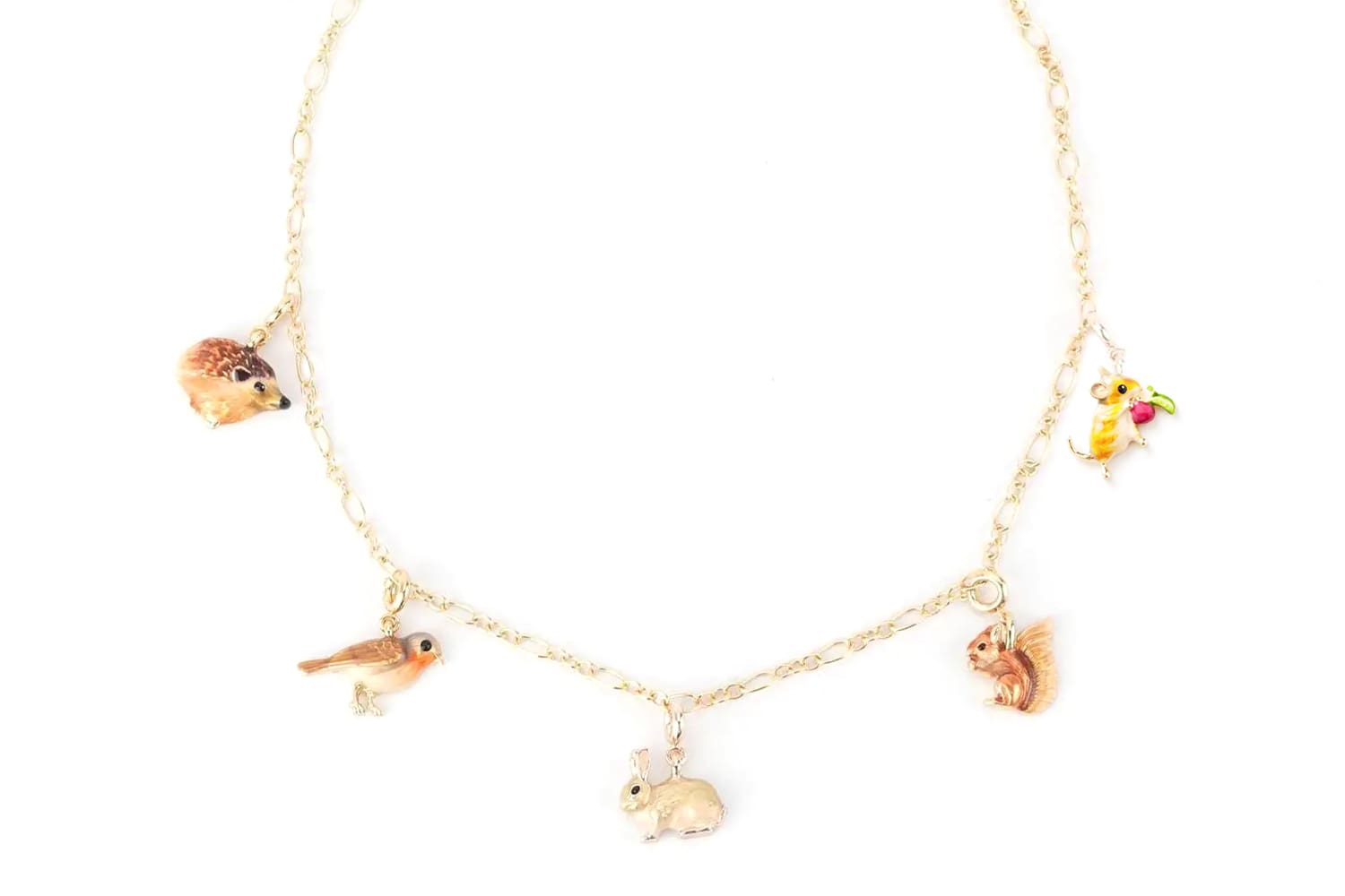 A selection of Fable England Charms on a Fable England Oval Figaro Chain Bracelet