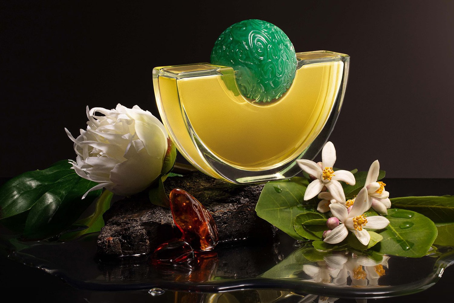 Lifestyle shot of Formosa Eau de Parfum with flowers in the foreground and background