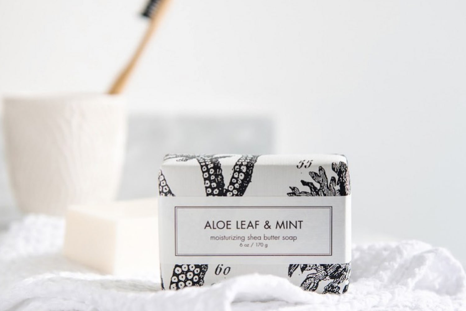 Lifestyle shot of Formulary 55 Aloe Leaf & Mint Bath Bar
