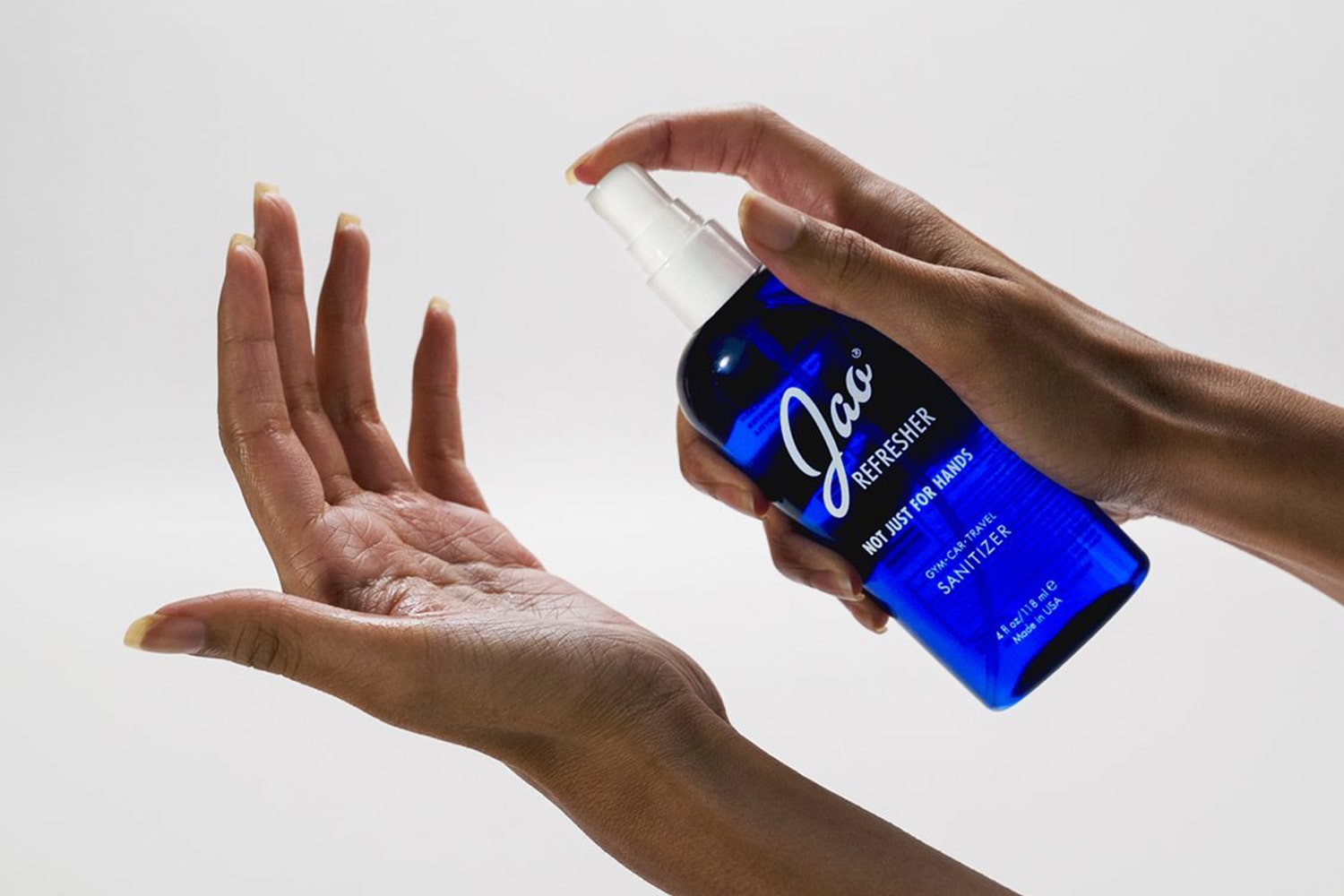 Jao Hand Refresher shown being sprayed on hand