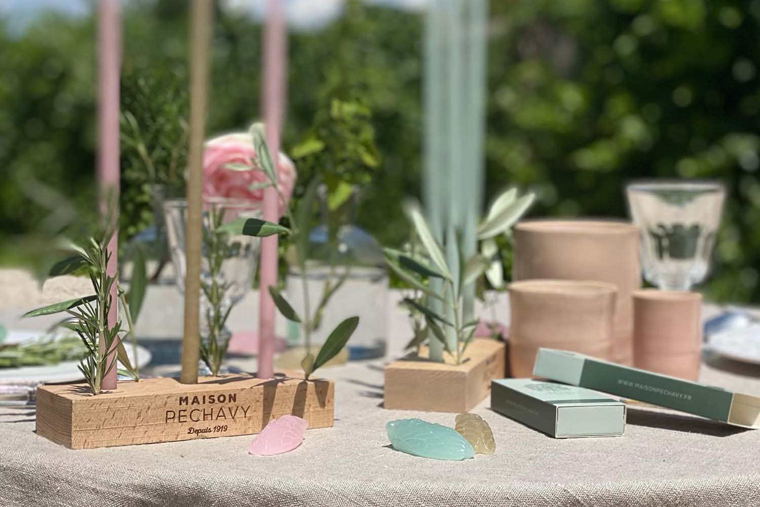 Lifestyle shot of Maison Pechavy Wooden Candle Holder on outdoor table setting