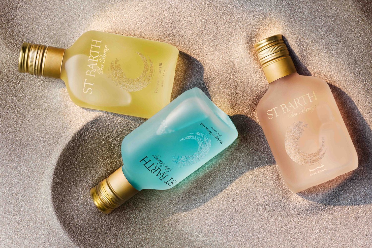 Beauty shot top view of the Sea Breeze collection on sand from Ligne St. Barth
