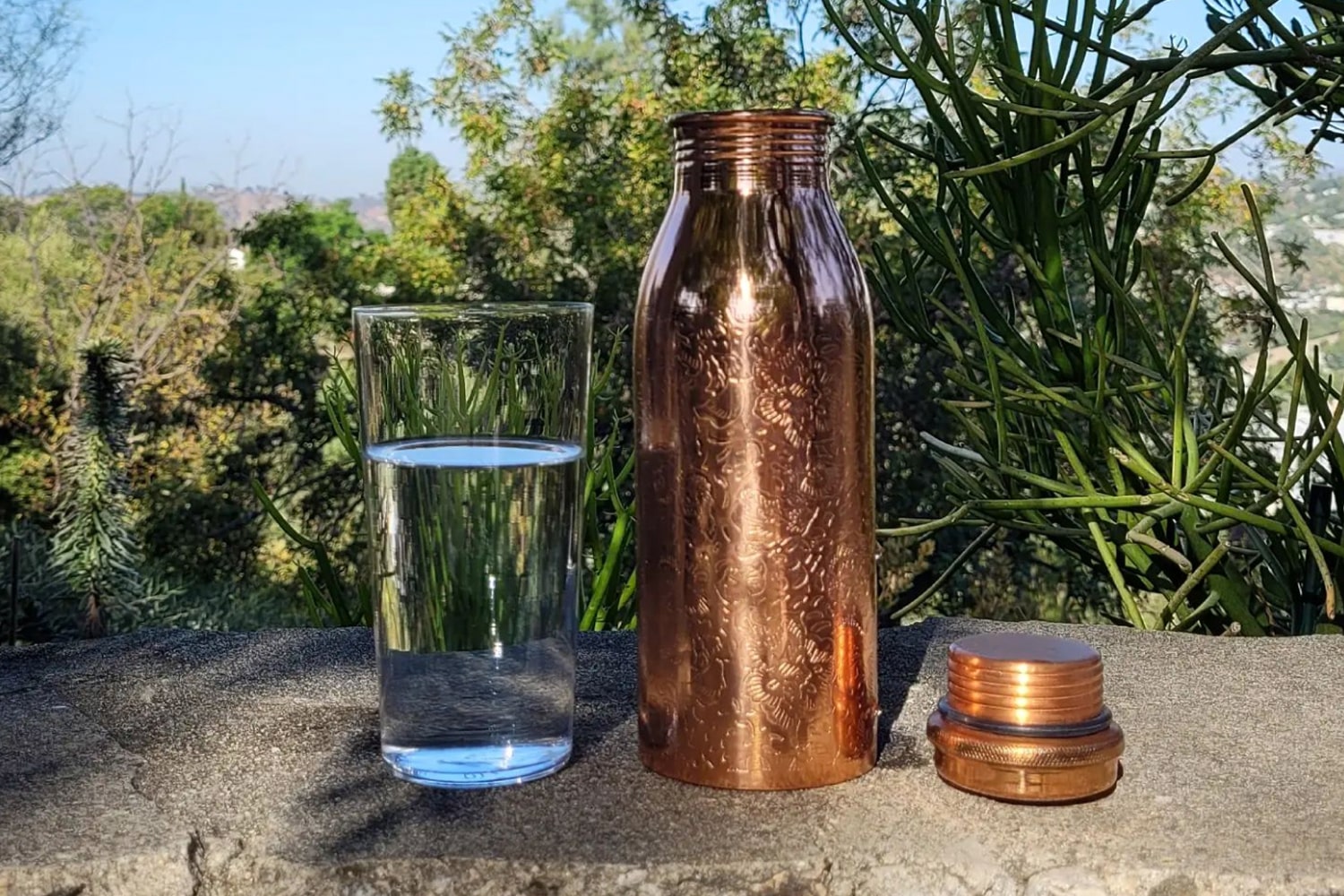 Lifestyle shot of Tamra Copper LA Tamra Ayurvedic Copper Water Bottle in Eden