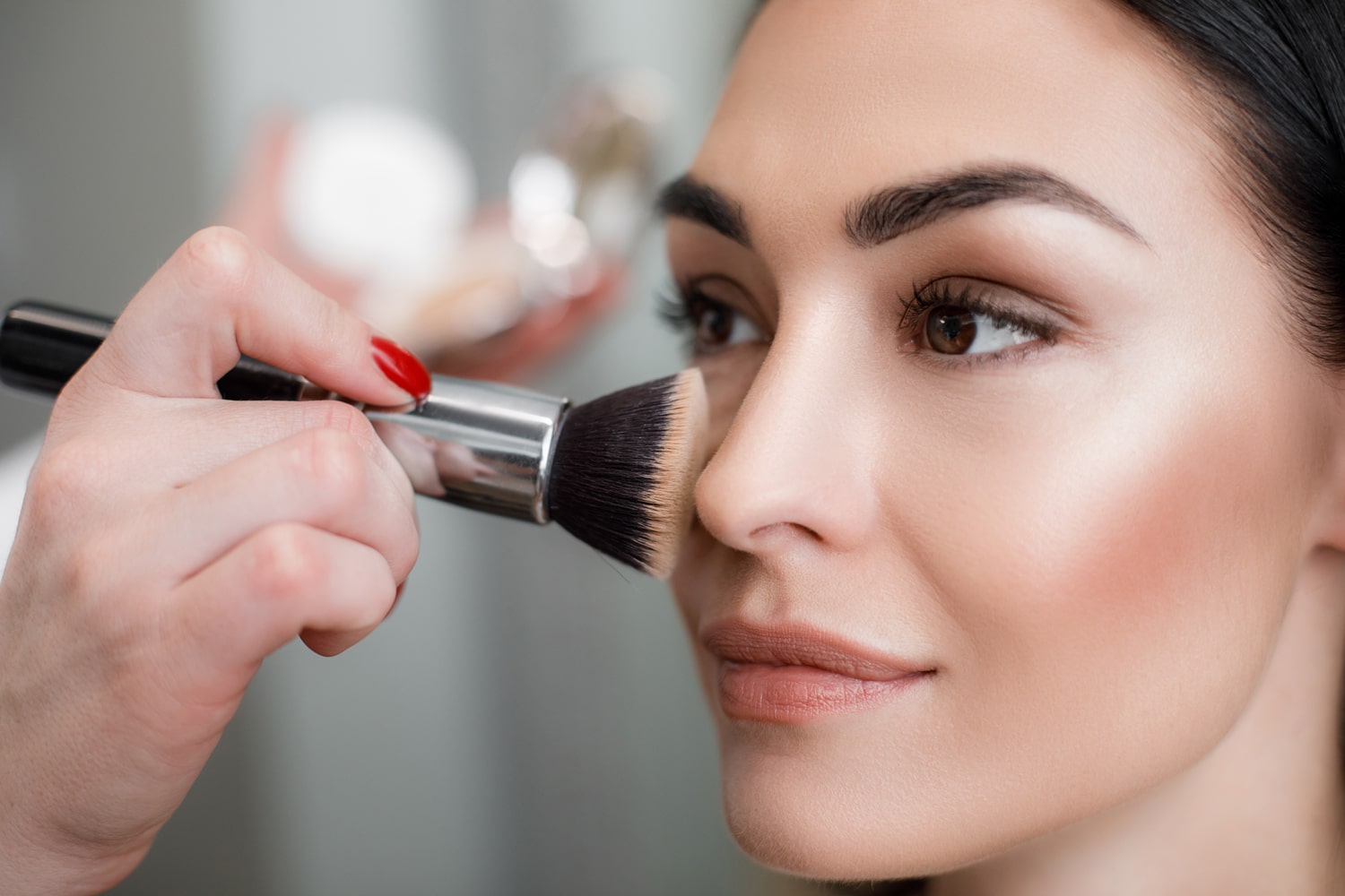 T. LeClerc Paris Loose Powder being applied to model's face