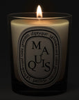 Diptyque Maquis Candle - lit candle shown
