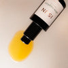 Close up of ISUN Ultra Sapphire Facial Oil Moisturizer (30 ml) showing product swatch