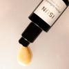 Close up of ISUN Phyto-Infusion Facial Serum (30 ml) showing product swatch