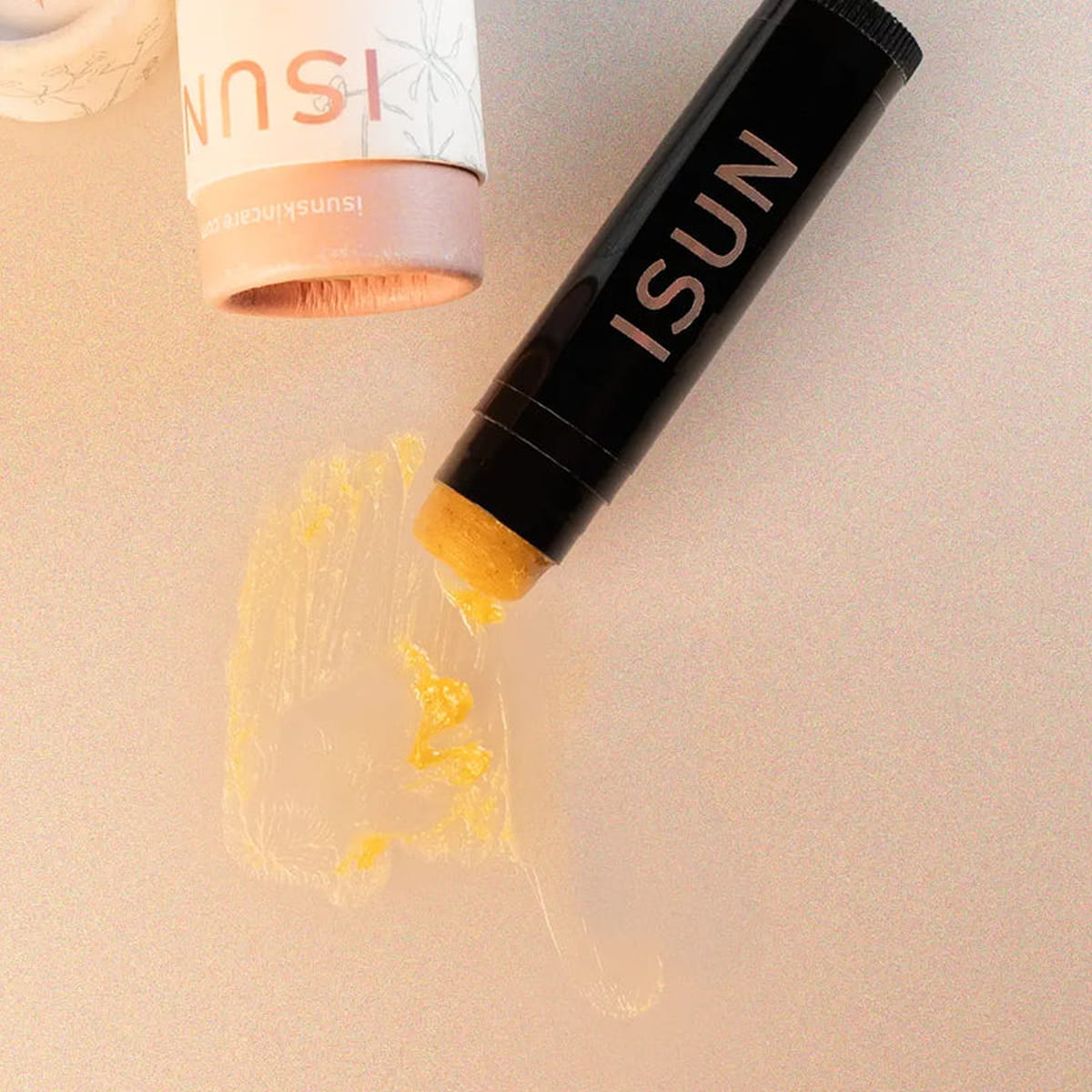 Close up of  ISUN Golden Lip Balm (5 ml) showing product swatch