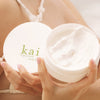 Kai Fragrance Body Butter (6.4 oz) held by a person.