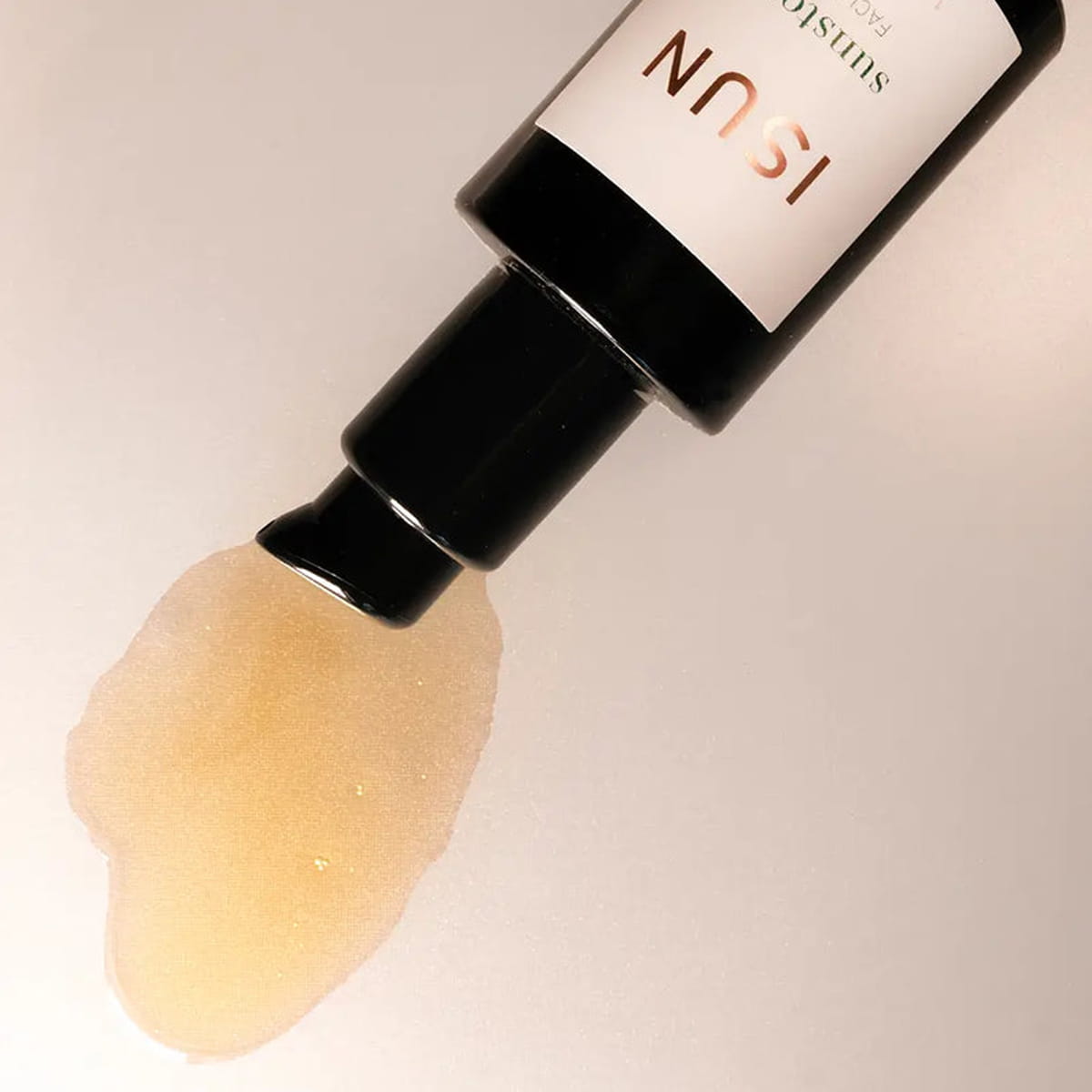 Close up of ISUN Sunstone Facial Oil (30 ml) showing product swatch