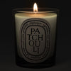 Diptyque Patchouli Candle - lit candle shown