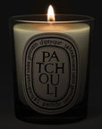 Diptyque Patchouli Candle - lit candle shown