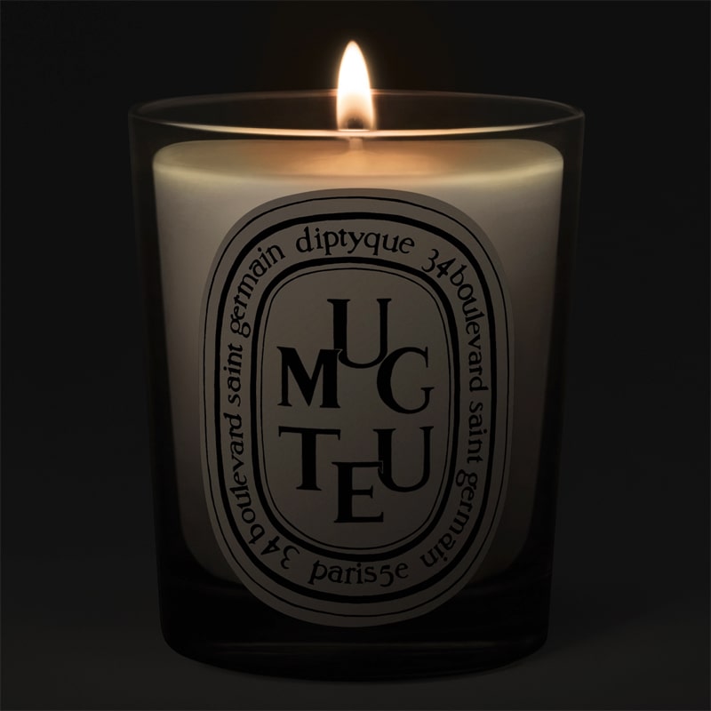 Diptyque Muguet (Lily of the Valley) Candle - lit candle shown