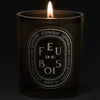 Diptyque Feu de Bois "Gris" Candle (300 g) - product shown on dark background. 