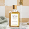 Rahua by Amazon Beauty Rahua Voluminous Shampoo - 275 ml - product shown next to sink.