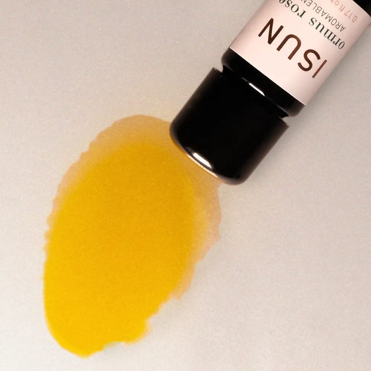 Close up of ISUN Ormus Rose Aromablend (5 ml) showing product swatch