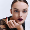 Lifestyle shot of model wearing Kure Bazaar Nail Lacquer - Cherie