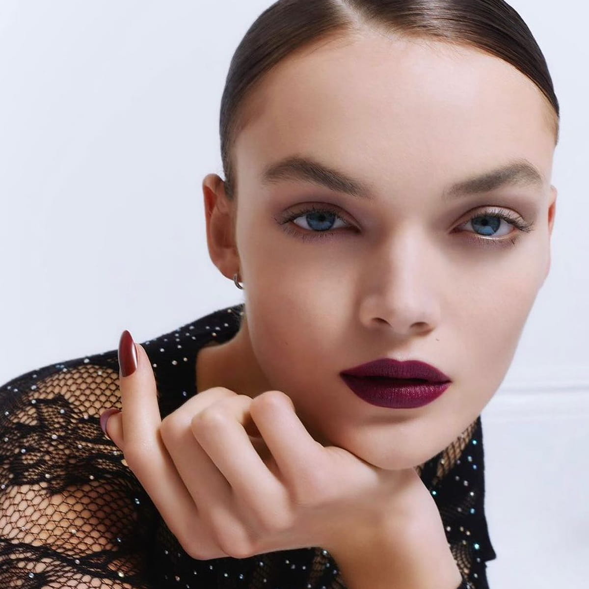 Lifestyle shot of model wearing Kure Bazaar Nail Lacquer - Cherie