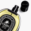Diptyque L'Ombre Dans L'Eau Eau de Parfum (75 ml) - product shown laying on side with lid off. 
