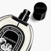 Diptyque Philosykos Eau de Parfum Spray 75 ml - product shown laying on its side with lid off. 