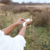 Model using Herban Essentials Eucalyptus Towelette on hands