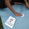 Model using Herban Essentials Yoga Towelette on yoga mat