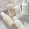 Kai Fragrance Travel Set (6 pc) on a marble surface with a white towel in the background.