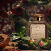 Lifestyle shot of Santa Maria Novella Pomegranate (Melograno) Cologne - 100 ml with flowers and pomegranate in the foreground