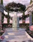 Lifestyle shot of Santa Maria Novella Rose Water (250 ml) in a rose garden with a column lined staircase