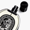 Diptyque Do Son Eau de Parfum (75 ml) - product shown laying on back on white background. 