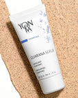 Yon-Ka Paris Guarana Scrub (50 ml) shown top view with large product smear in the background to show color and texture of scrub