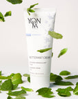 Lifestyle shot of Yon-Ka Paris Nettoyant Creme (100 ml) with mint in the background