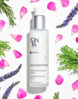 Yon-Ka Paris Emulsion Pure (50 ml) shown top view with pink flower petals, lavender and rosemary surrounding the bottle
