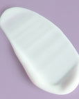 Yon-Ka Paris Hydra No. 1 Masque smear on purple background to show color and texture of product