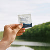 Ursa Major Essential Face Wipes (20 pcs) - model shown holding product near lake