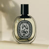 Diptyque Tam Dao Eau de Parfum spray (75 ml) - product shown on creme background. 